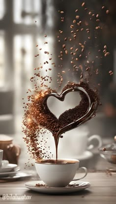 coffee being poured into a white cup in the shape of a heart with grains coming out of it