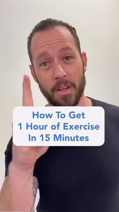 a man holding up a sign that says how to get 1 hour of exercise in 15 minutes