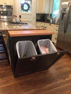 two bins in the middle of a kitchen island