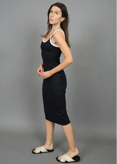 Unleash your sophistication with the Tanith Tank Midi Dress from Second Skin by RD Style. With a classic tank silhouette and a flattering midi length, this dress exudes sleek and timeless elegance. A must-have for any occasion, add this versatile black dress to your wardrobe for an elevated and confident look. If you would like to see more photos or speak with one of our stylists with any further questions regarding this specific product, please call us at 678-309-9550 anytime during business ho V Neck Midi Dress, Black Midi Dress, Second Skin, Midi Length, Free Size, Timeless Elegance, Must Haves, Black Dress, Midi Dress