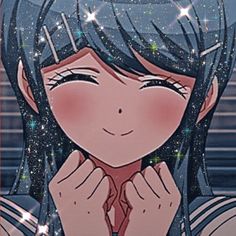 a girl with blue hair and stars on her face is holding her hands to her chest