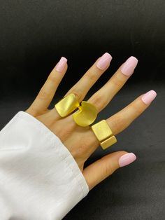 Discover our exquisite collection of unique gold statement rings, each crafted with exceptional attention to detail. Choose from a variety of designs including chunky, textured, and chain-inspired styles, perfect for adding a touch of elegance and boldness to any outfit. Each ring is sold separately, allowing you to select the exact style that suits your personal taste. Elevate your jewelry collection with these stunning pieces, ideal for both special occasions and everyday wear. Features: *Indi Chic Metal Jewelry With Ring Detail, Gold Ring With Unique Variations, Modern Gold Wide Band Metal Ring, Elegant Bold Design Jewelry Gift, Elegant Bold Design Jewelry As A Gift, Elegant Bold Design Jewelry For Gift, Elegant Bold Designed Jewelry For Gift, Trendy Chunky Gold Jewelry, Modern Gold Jewelry With Unique Variations