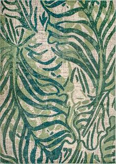 a green and white rug with leaves on it