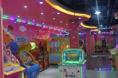 the inside of a children's play room with arcade machines