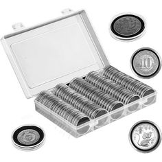 a box filled with lots of silver coins next to some other coin sets on a white background