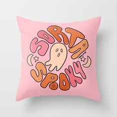 a pink pillow with an image of a ghost on it