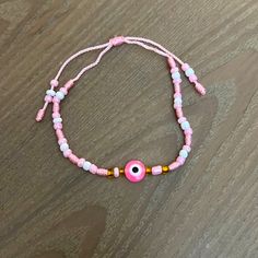 Beautiful Pink Evil Eye Bracelet Never Worn. Trendy Pink Bracelet With Adjustable Length, Trendy Pink Adjustable Bracelet, Trendy Pink Adjustable-length Bracelet, Casual Pink Bracelets With Adjustable Length, Casual Pink Bracelet With Adjustable Length, Adjustable Pink Evil Eye Bracelet, Pink Adjustable Evil Eye Bracelet Trendy, Adjustable Pink Evil Eye Trendy Bracelet, Handmade Casual Evil Eye Bracelet