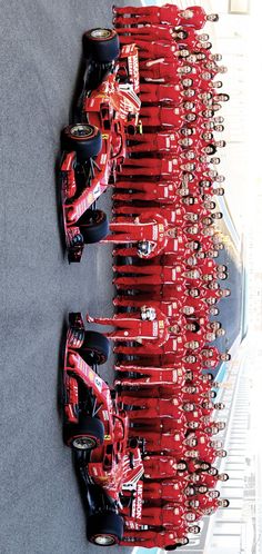 several red race cars lined up in rows