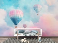 a baby's room with hot air balloons in the sky