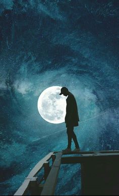 a man standing on top of a pier in front of a full moon at night