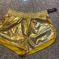 Nwt Gold Shiny Stretch Shorts With Pockets. Sz Xxl But Runs Small And Fits Like Large Or Xl Gold Bottoms With Built-in Shorts For Summer, Gold High-waisted Shorts For Summer, Summer High-waisted Gold Shorts, Gold Stretch Short Bottoms, Gold Stretch Summer Shorts, Trendy Gold Shorts For Spring, Casual Gold Shorts For Night Out, Casual Stretch Gold Bottoms, Gold Bottoms With Elastic Waistband For Summer