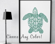 a green turtle is shown on the wall next to a lamp and a framed photograph