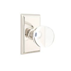 an image of a door handle on a white wall mounted light fixture with glass knobs