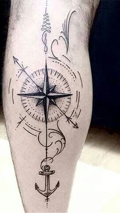 a man's leg with an anchor and compass tattoo on the side of his calf