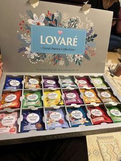 an open box of lovare products on a table with people in the background