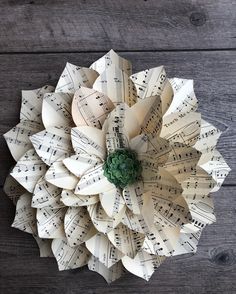 an origami flower made out of sheet music