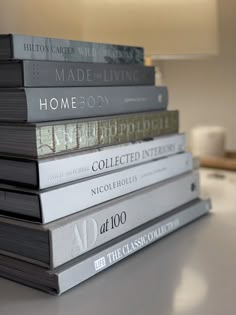 a stack of books sitting on top of a table