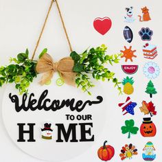 a welcome sign hanging from the side of a wall with stickers and magnets on it