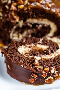 there is a chocolate cake with nuts on it