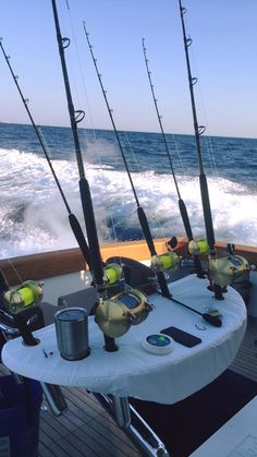 several fishing rods on a boat in the ocean