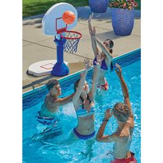 four people are playing basketball in the pool