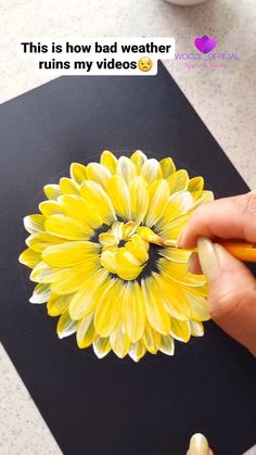 someone is drawing a sunflower with colored pencils