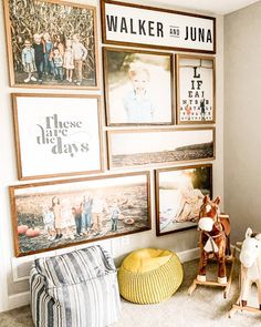 a living room with pictures on the wall and toys in front of it, including a rocking horse