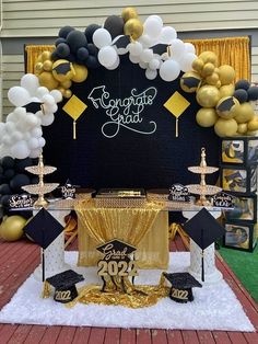 a graduation party with balloons and decorations