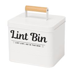 a white lunch box with the words lint bin printed on it and a wooden handle