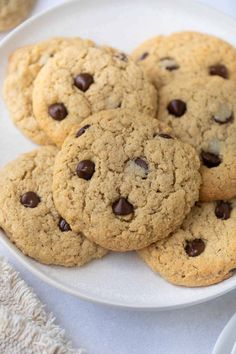 a white plate topped with chocolate chip cookies