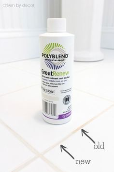 a bottle of polyblend groutremew sitting on the floor next to a toilet