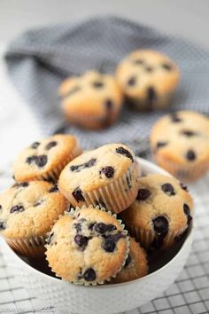 blueberry muffins in a white bowl on a table