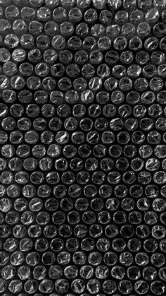 black and white photograph of plastic bottle caps