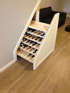 an open wine rack in the corner of a room