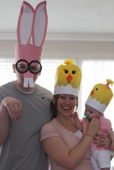 a man, woman and child wearing easter hats