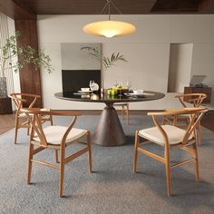 a dining room table with four chairs around it