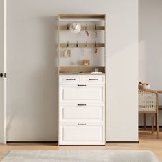 a white cabinet sitting in the corner of a room