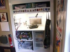 an open refrigerator door with various items on the shelves and below it are magnets