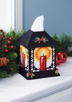 a small house with a candle on it