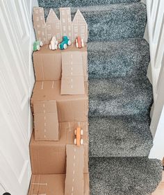 cardboard boxes are stacked up on the stairs