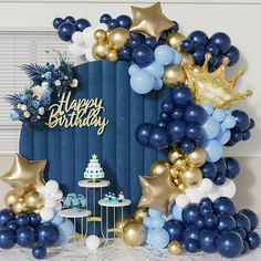 a blue and gold birthday party with balloons