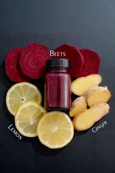 beets, lemon, and ginger are arranged on a black surface with the words beets above them