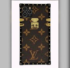 the back side of a louis vuitton phone case with studded edges and gold hardware