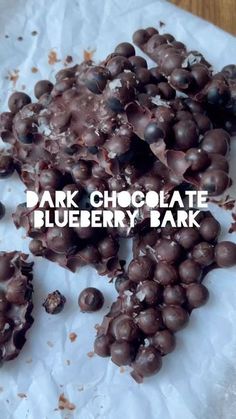 dark chocolate blueberry bark on a piece of white paper with the words, dark chocolate blueberry bark