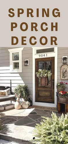 the front porch is decorated with potted plants and wreaths for spring or fall