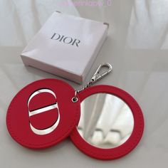 100% Authentic Dior Faux Leather Keyring Or Purse Charm In Red . Two Circles Together, The Top One With An Embedded, Mirrored "Cd" Logo And The Bottom One Features A Leather Framed Mirror That's Protected By The Top Circle. Silver Hardware. Original Dior Box Included. Should You Wanted To Take Advantage Of The Free Gift Wrapping. I Will Include The Original Box But Attempt To Find A Nicer Gift Box For Wrapping. I Use The Designer's Wrap And/Or Bow If I Have It & While Supplies Last, But I Do Hav Merchandise Ideas, Leather Frames, Leather Keyring, Framed Mirror, 10th Anniversary, Purse Charms, Free Gift Wrapping, Key Card Holder, Silver Hardware