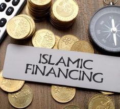 a keychain with the word global islamic finance on it next to some gold coins