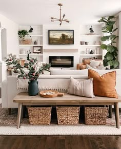 the living room is clean and ready for us to use it's natural wood flooring