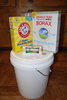 a box of borax sitting on top of a trash can