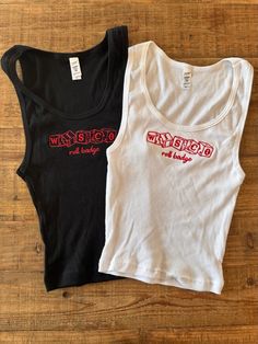 2x1 baby ribbed crop tank top with a scoop neckline and red wisco dice embroidery. Runs small - we recommend sizing at least one size up! Casino Bid Day, Cute College Merch, Sorority Tank Tops Design, Cute Merch Ideas, Graphic Tank Tops Aesthetic, Cool Merch Ideas, Sorority Merch Apparel Design, Dice Embroidery